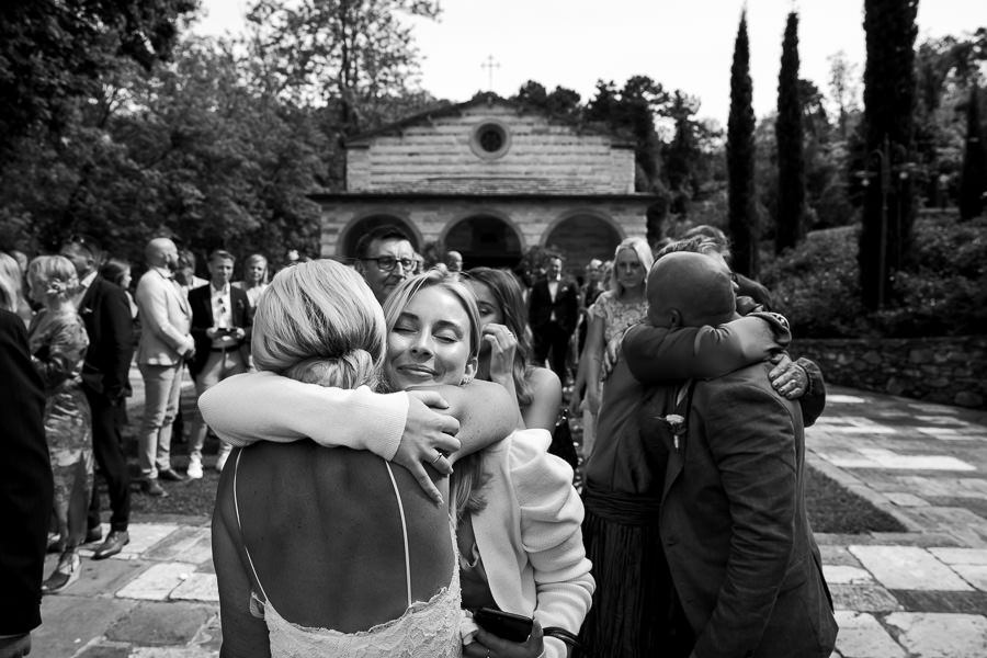 Bride and groom leaving wedding church in Tuscany