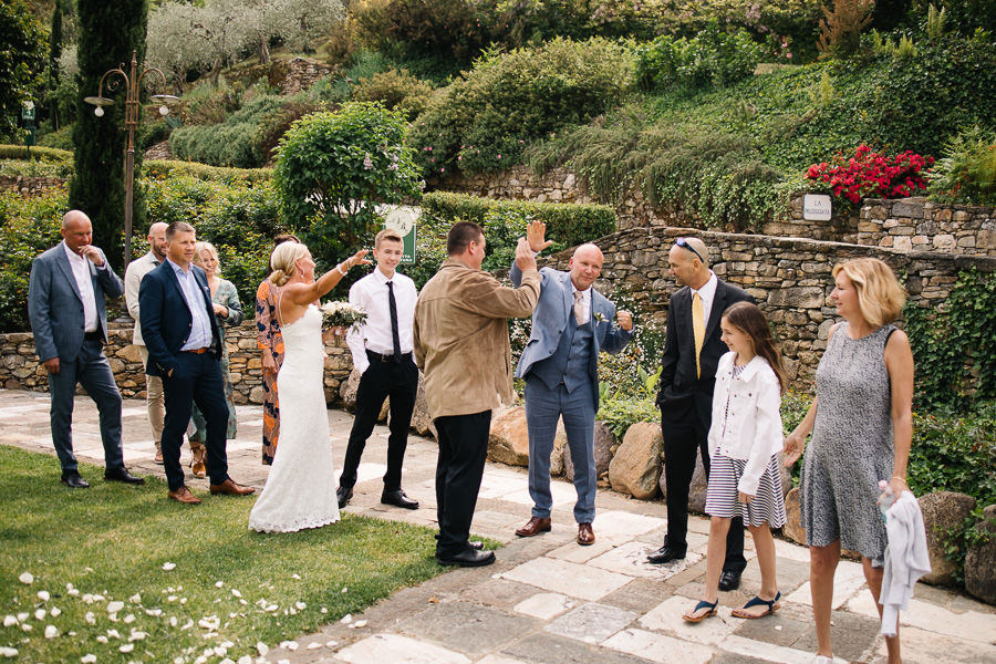 Hugs and kisses at wedding at Antico Borgo Valle Di Badia
