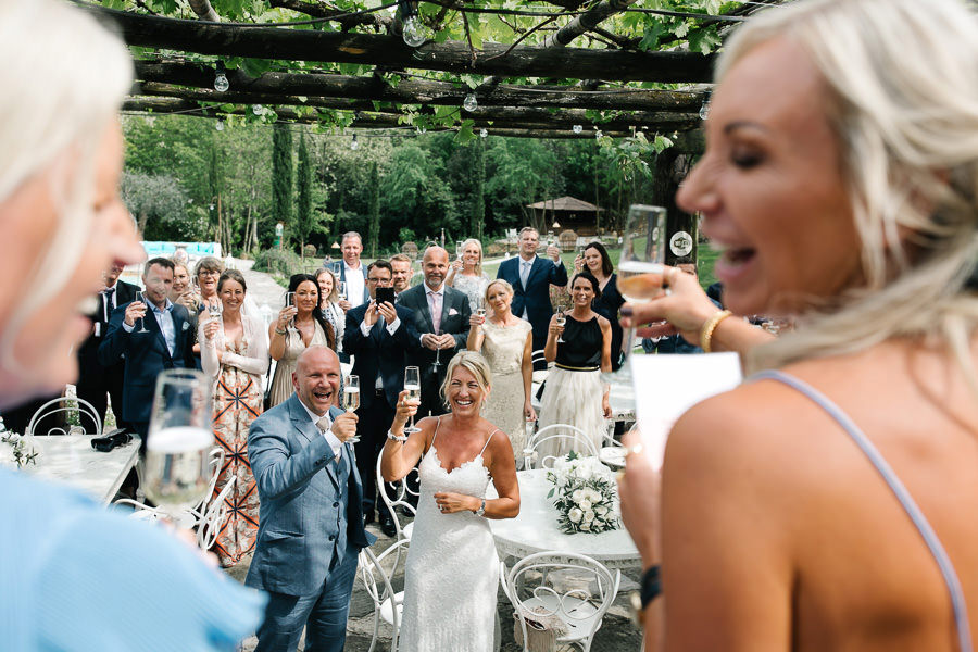 Hugs and kisses at wedding at Antico Borgo Valle Di Badia