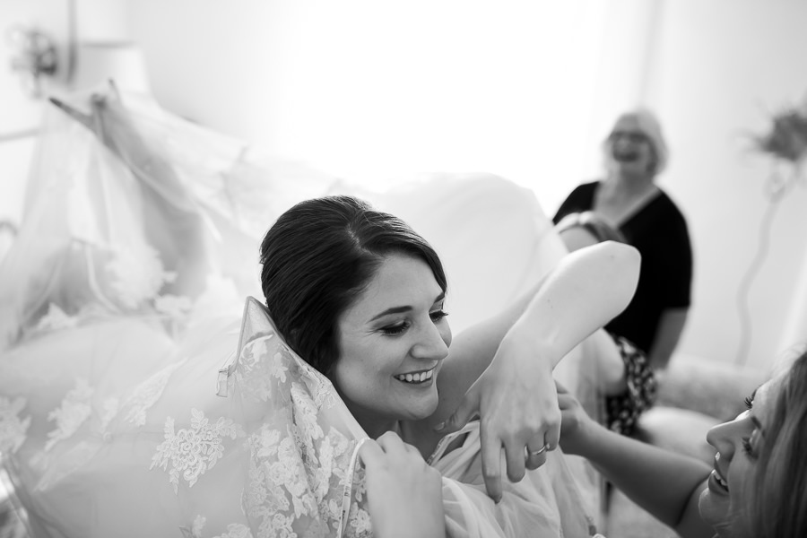 bride getting her makeup done for wedding