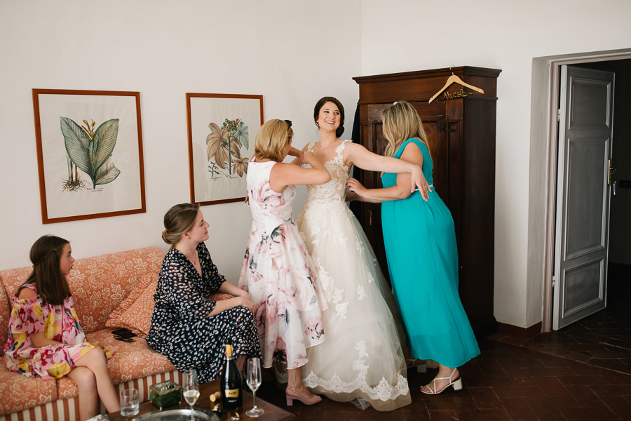 bride getting her makeup done for wedding