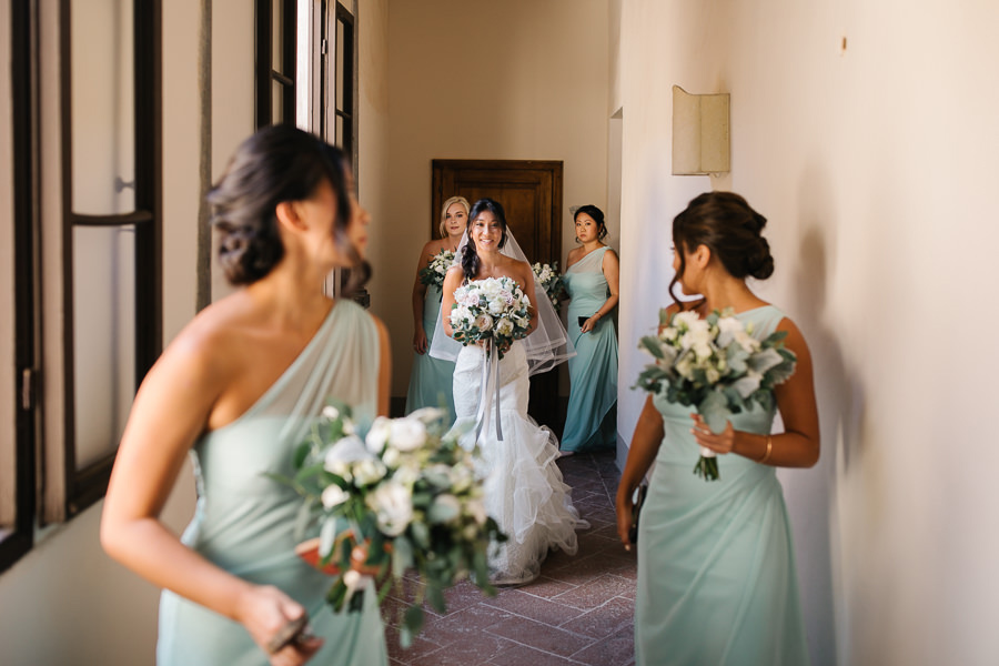 bride with her dress and veil at castello di meleto