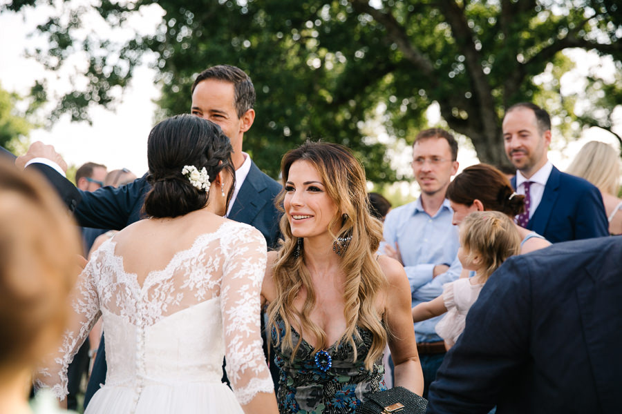 bride and groom walking down the aisle to castello di meleto