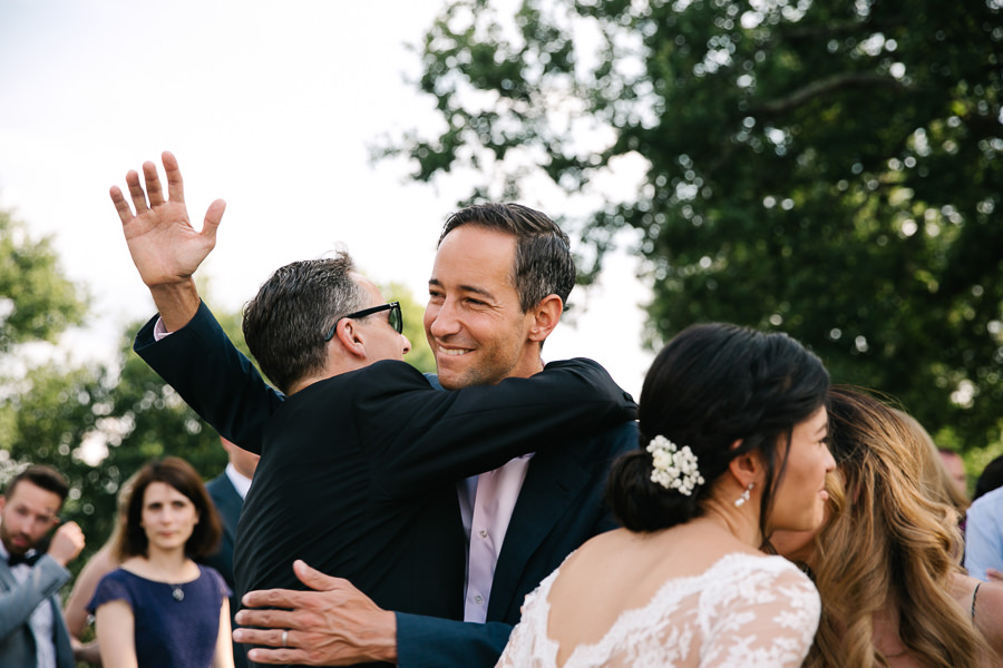 hugs and kisses during wedding at castello di meleto