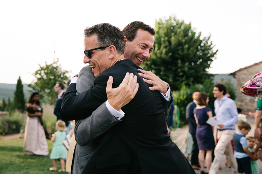 hugs and kisses during wedding at castello di meleto