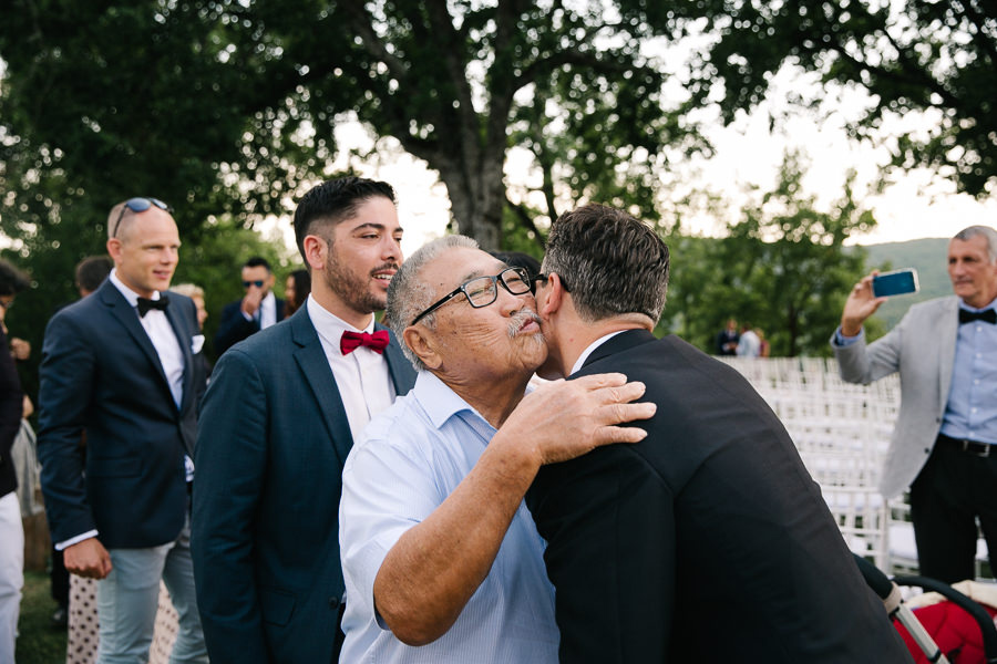 hugs and kisses during wedding at castello di meleto