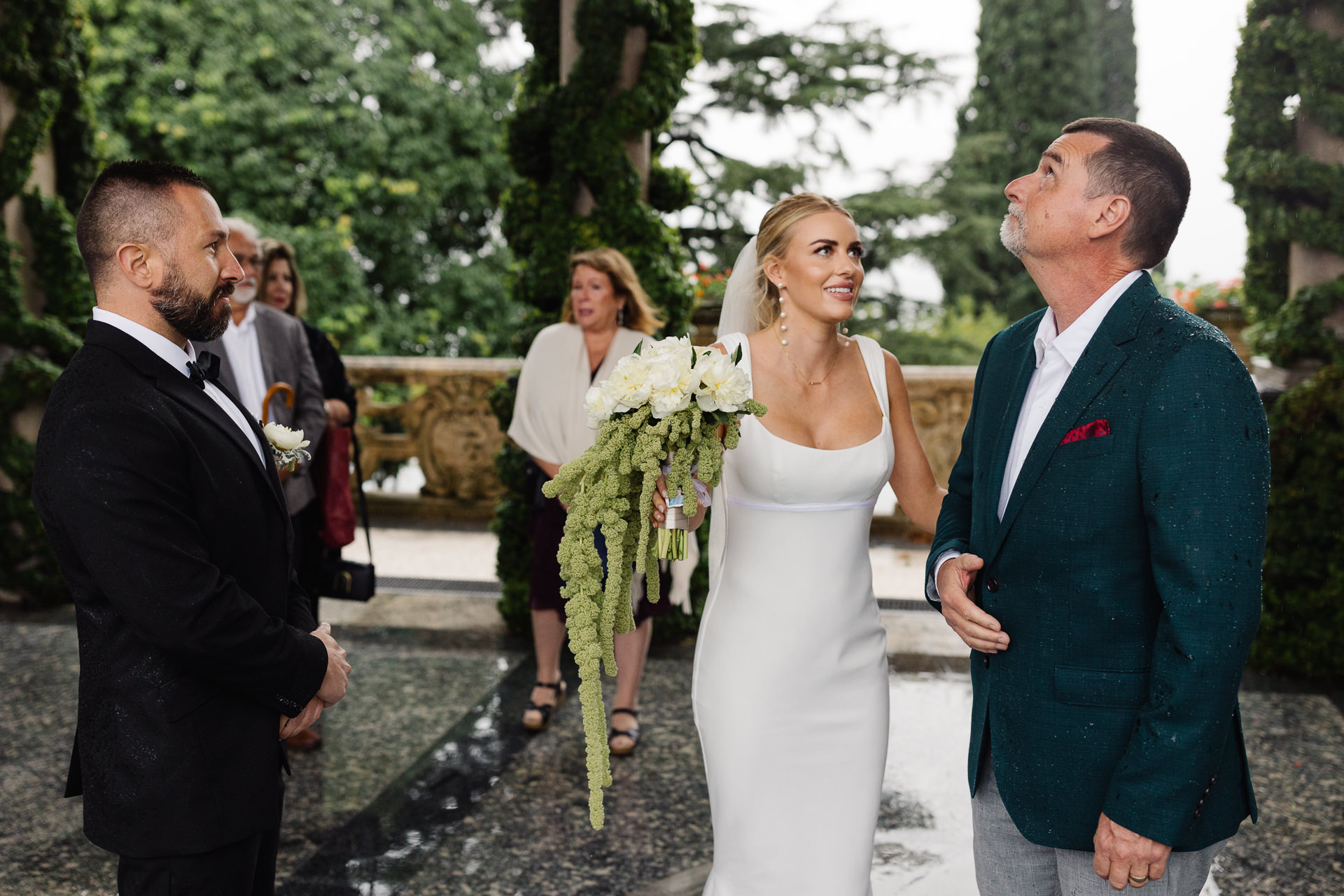 Wedding Pic from Italy at Lake Como Villa del Balbianello | the brides father looks to the skies