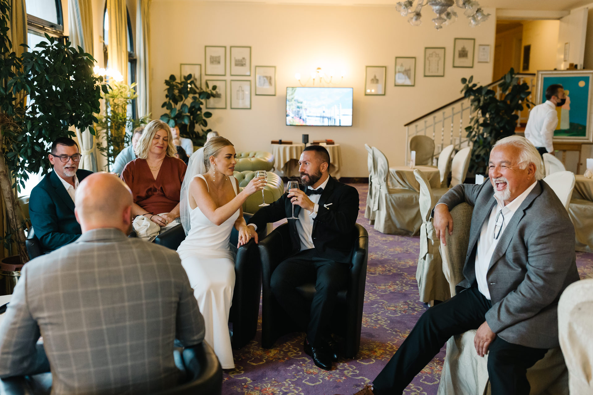 Lake Como Wedding Photography | Bride and groom Sitting with their guests